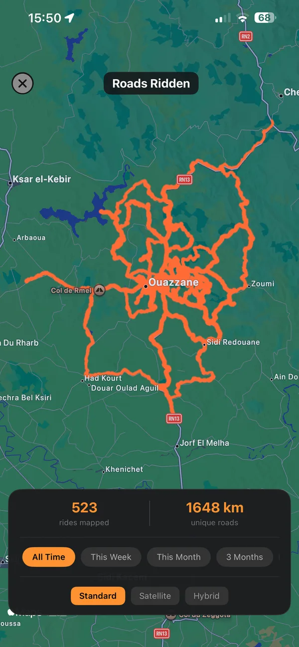 The Roads Ridden map: every recorded road around Ouazzane drawn in orange, 523 rides mapped and 1,648 km of unique roads.